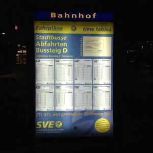 Large format printing of bus timetable with light at night
